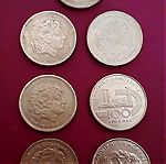  7 παλαιά, ελληνικά συλλεκτικά νομίσματα, των εκατό δραχμών με τον Μέγα Αλέξανδρο και τον Ήλιο της Βεργίνας και από το παγκόσμιο πρωτάθλημα στίβου και ελληνορωμαϊκής  πάλης.