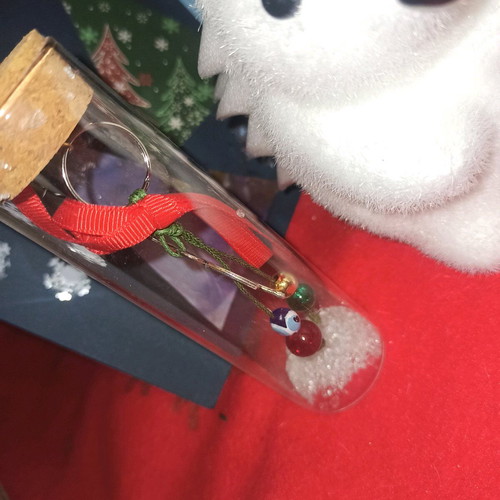 Christmas charm new in glass bottle with evil eye and small gem