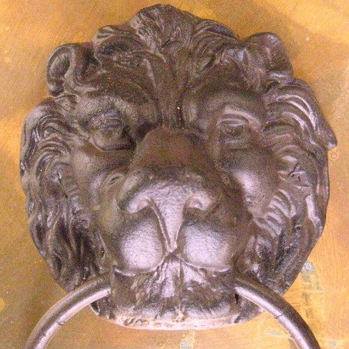 Cast iron door knocker used with lion head