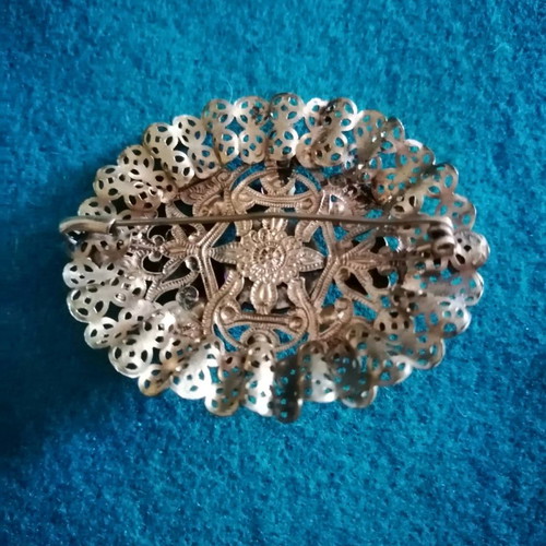 Vintage filigree brooch like new with central stone and rose crystals