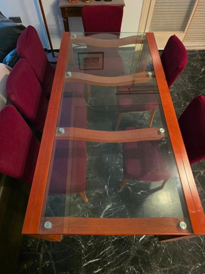 Dining table with glass top and 6 burgundy chairs used