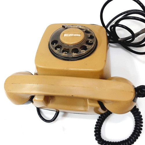 Vintage rotary phone used, beige, 1970s