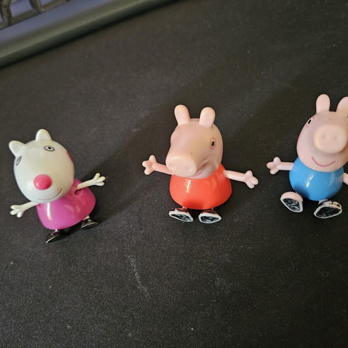 Peppa and Minnie figures used with minor paint wear