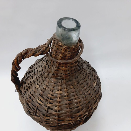 Dame-Jeanne vintage demijohn bottle used, glass with wicker
