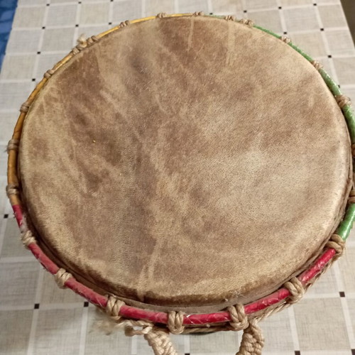 Traditional African djembe drum, carved wood and natural skin