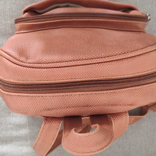 Back pack tan used with internal and external pockets