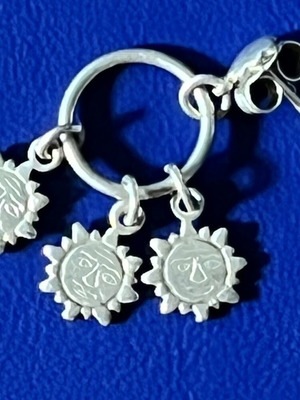 Earrings hoops with 3 hanging suns, like new, silver color