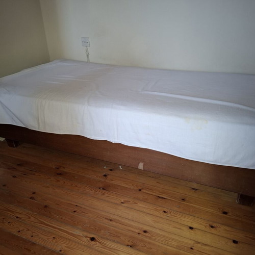 Single bed used with mattress and pillow