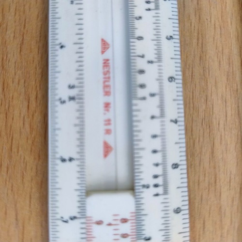 Logarithmic slide rule with case