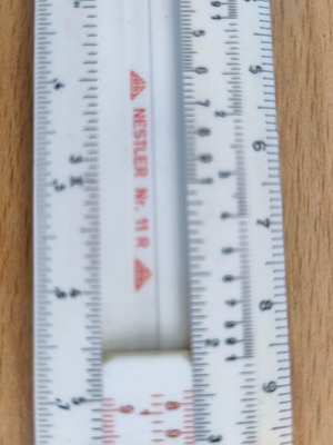 Logarithmic slide rule with case