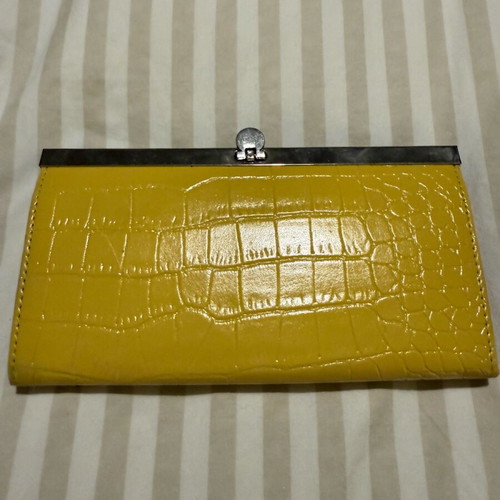 Clutch wallet like new, yellow, bought from NY