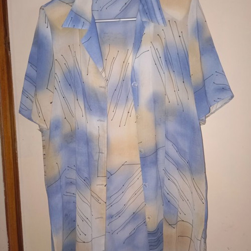 Light vintage women's shirt with short sleeves, buttons, collar, abstract print