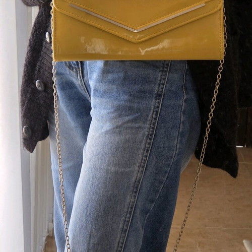 Aldo yellow vinyl clutch bag used with gold trim