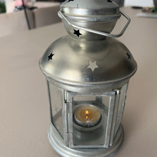 Silver candle lantern used for garden, balcony, or indoor candle