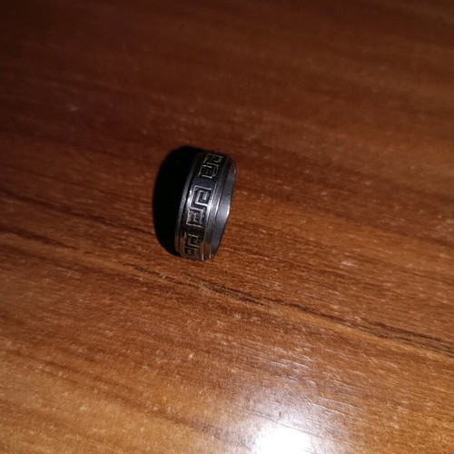 Steel ring used, silver with wear on design color