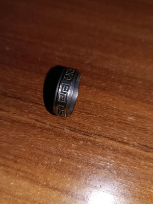 Steel ring used, silver with wear on design color