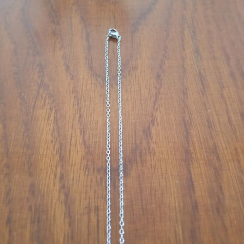 Steel cross like new, silver color