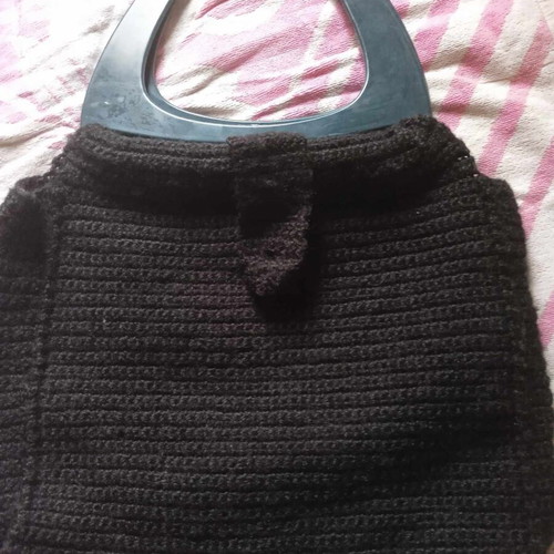 Knitted handbag like new, black with button
