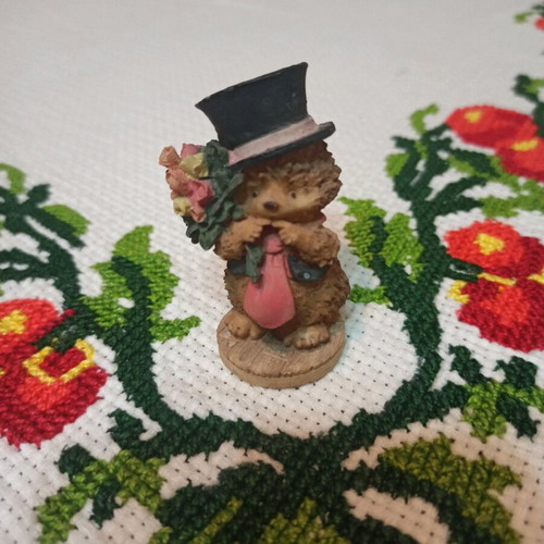 Hedgehog miniature figurine used, decorative with hat and flowers