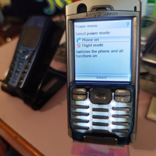 Sony Ericsson P990i vintage cell phone used with charger