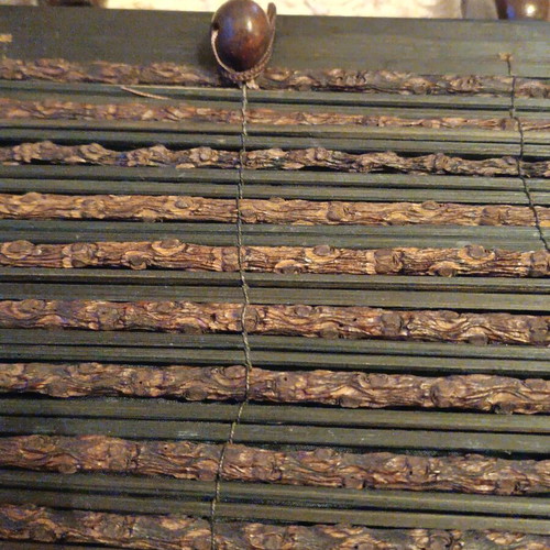 Wooden bag with slightly faded strap