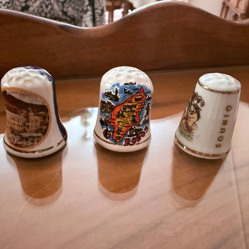 Collection of 12 collectible tourist thimbles