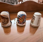 Collection of 12 collectible tourist thimbles