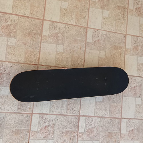 Xiaoluhu skateboard used with rock patina and skulls