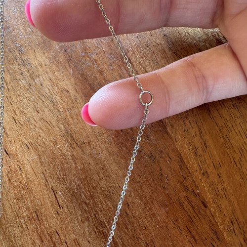 Steel necklace chain with mother-of-pearl and zircon pendant