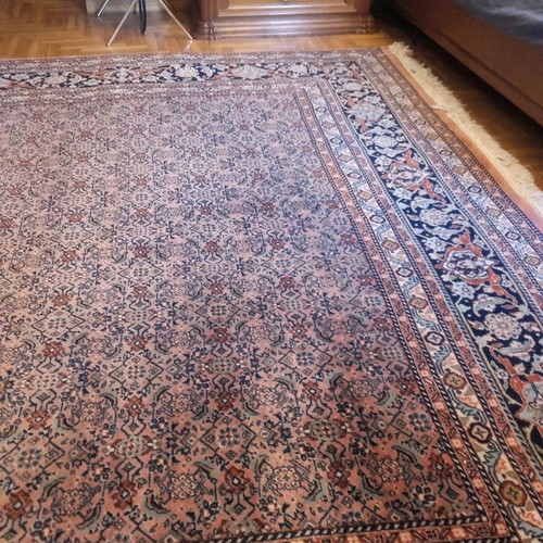 Handmade wool rug used, approximately 10 sqm