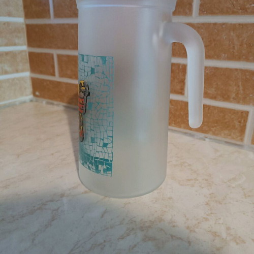 Glass pitcher with butterfly design like new