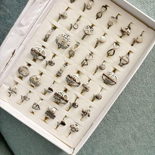 Box of 36 new steel rings with adjustable and fixed sizes