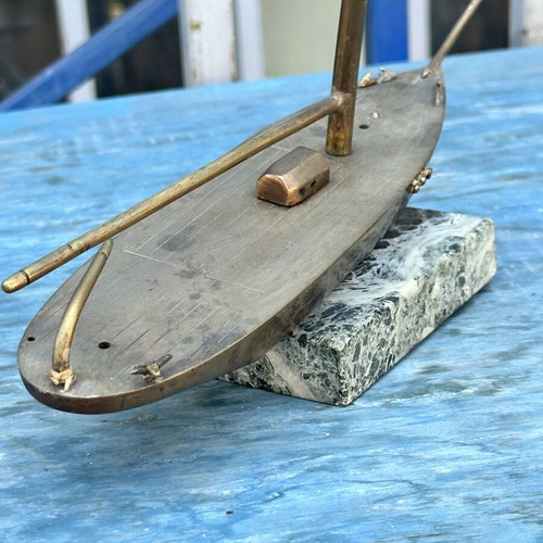 Vintage brass sailboat decoration on marble base, used