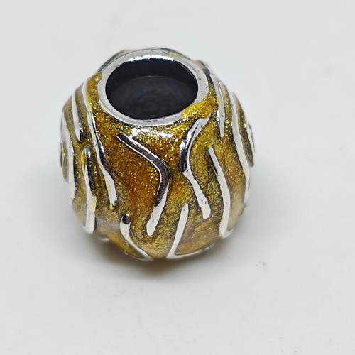 Silver charm bead with gold glitter enamel spiral design like new
