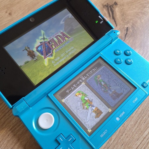 Nintendo 3DS Coral Blue like new with original stylus and USB cable
