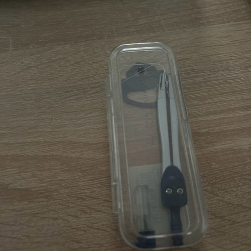 Divider with tip used, case included