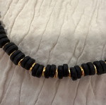 Necklace set used with black and gold beads and steel chain