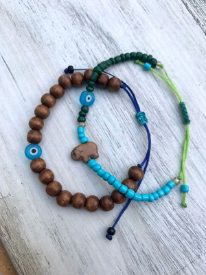 Bracelets new, brown and turquoise with wooden beads and glass eyes