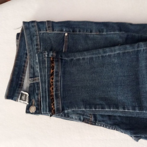 Slim fit blue jeans with leopard detail at hem