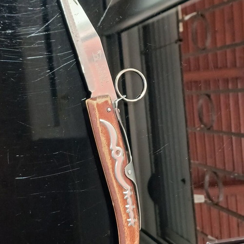 Okapi pocket knife used, carbon steel blade, wooden handle