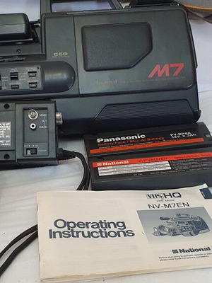 Panasonic M7 video camera like new with two batteries, extra lens, and carrying case