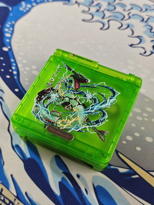 Gameboy Advance SP shell used, matte translucent green with Rayquaza UV print