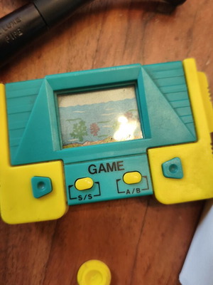 Retro handheld electronic game used from the 90s
