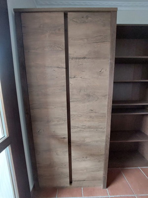 Two-door wardrobe with shelves and hanging rod