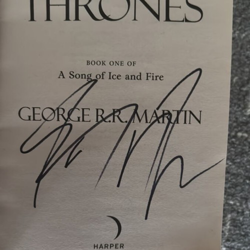 A Game of Thrones book with fake George RR Martin signature new, English