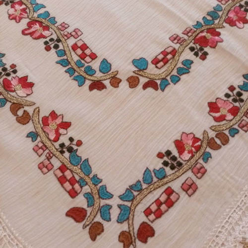 Handmade old embroidery painted and hand-stitched with lace