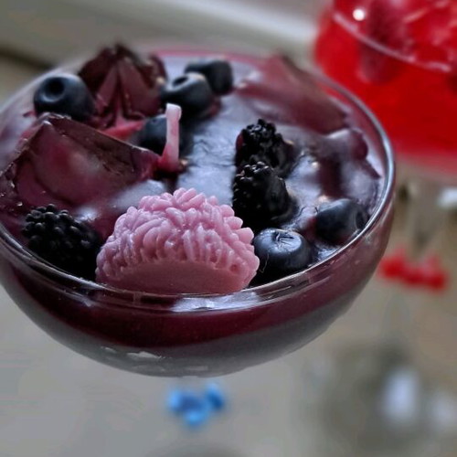 Soy and gel wax candle in cocktail glass with strawberry and blueberry scent