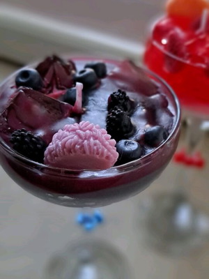 Soy and gel wax candle in cocktail glass with strawberry and blueberry scent