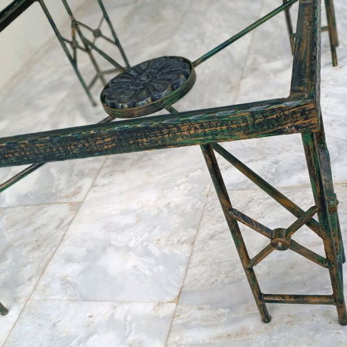 Metal table used with ceramic decoration and antique finish