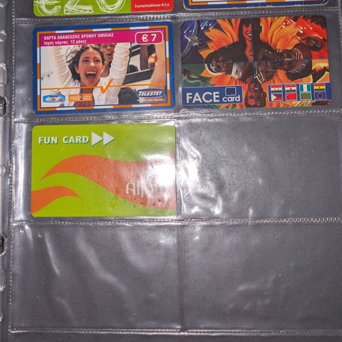 Black folder like new with 25 phone cards and cards
